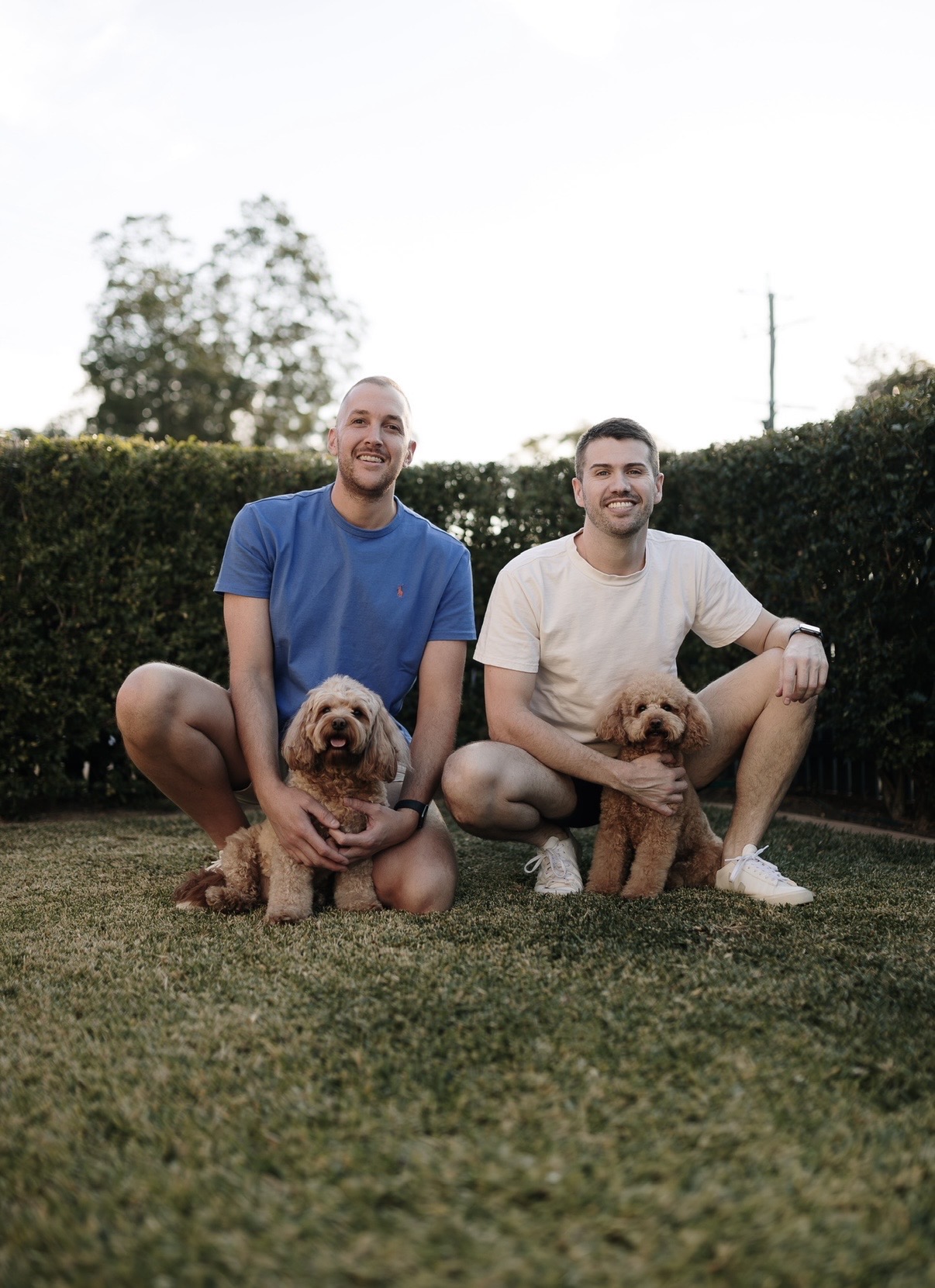 PJ and Dion with their Cavoodles Lottie and Lola