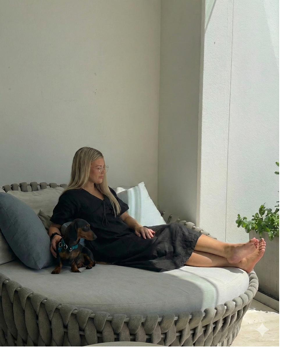 Elegant lifestyle shot with dachshund on designer furniture